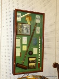 (WALL2) LARGE VINTAGE CROQUET SHADOWBOX; HAS A MALLET, SEVERAL PRINTED RULE BOOKS AND PAMPHLETS, AND
