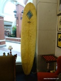NEW SUN OUTER BANKS SURFBOARD; LONG ROUND NOSE BOARD, PALE YELLOW IN COLOR WITH SINGLE DARKER GOLD