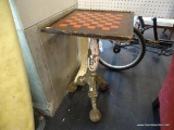 PEDESTAL GAME TABLE; SQUARE SHAPED WITH REMOVABLE WOODEN TOP WHICH HAS A RED AND BLACK CHECKERBOARD