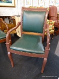 WOODEN ARMCHAIR WITH GREEN BACK AND SEAT AND RIVETED DETAIL; ROLLED WOODEN TOP RAIL WITH ARMS WHICH