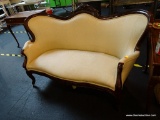CARVED VICTORIAN SETTEE WITH CREAM COLORED UPHOLSTERY; LATE 19TH CENTURY STYLE WALNUT SETTEE,