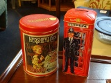 PAIR OF COLLECTIBLE CHOCOLATIERS TINS; ONE FROM HERSHEY, OTHER FROM RUSSELL STOVER. BOTH ARE RED IN