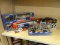 HALF SHELF LOT OF NASCAR ITEMS; INCLUDES 2 WINNERS CIRCLE 1:64 SCALE TRAILER RIGS, A RACING