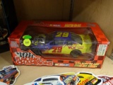 RACING CHAMPIONS 1:24 SCALE DIECAST STOCK CAR REPLICA; #29 WCW CAR. IS PURPLE AND YELLOW IN COLOR