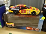 (END) NASCAR 1:24 SCALE DIECAST COLLECTIBLE STOCK CAR; #22 1999 TAURUS. YELLOW, BLACK, AND RED IN