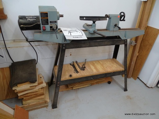 DELTA LATHE; DELTA 12 IN VARIABLE SPEED WOOD LATHE. MODEL 46-701. FLOOR MODEL WITH METAL BASE. 3/4