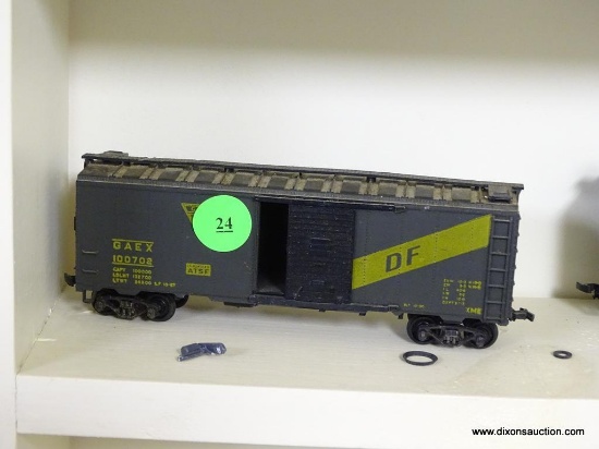 VINTAGE G A E X HO SCALE MODEL TRAIN BOXCAR; DARK GREY IN COLOR WITH GOLD COLORED PRINT ON SIDES.