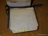 (ATT2) VINTAGE PAPER CUTTER; SQUARE SHAPED, GREY IN COLOR WITH RED SAFETY EDGE AND SHARP BLADED ARM.