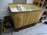(SIDE) LARGE ROLLING LINENS CART AND CONTENTS; CANVAS SIDED CART HAS METAL FRAME AND WHEELS AND