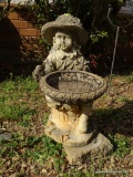 (OUT) STATUE OF A LITTLE GIRL; STATUE DEPICTING A LITTLE GIRL HOLDING A BASKET WHILE SITTING ON A