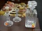 VINTAGE GLASS LOT; THIS 3 PIECE LOT INCLUDES A GLASS DECANTER AND 2 GLASS CANDLESTICK HOLDERS.