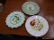 EGG PLAT LOT; THIS LOT INCLUDES 3 ASSORTED EGG PLATES. ONE IS WHITE WITH FRUIT AND FLOWERS ON IT