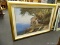 LARGE FRAMED MEDITERRANEAN PRINT; IMAGE OF A COLUMNED WALKWAY, ROCKY HILLSIDE DOTTED WITH WHITE