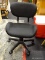 ROLLING OFFICE CHAIR; BLACK IN COLOR WITH A LOW RISE BACK SUPPORT. IN EXCELLENT CONDITION! MEASURES