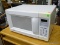 KENMORE MICROWAVE; HAS A QUICK TOUCH SENSOR AND 8 SETTINGS. MODEL 721.61282100. IS IN GOOD CONDITION