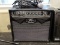 PEAVEY AMPLIFIER WITH MICROPHONE; BLACK VYPYR 15 1X8 15W GUITAR COMBO AMP WITH CARRYING HANDLE. THIS