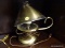 SMALL BRASS CANDLESTICK LAMP; METAL FAN SHAPED LAMPSHADE PERCHES ATOP BULB NESTLED INTO A