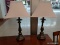 PAIR OF TABLE LAMPS; RECTANGULAR WHITE FABRIC LAMPSHADES WITH BULLET SHAPED FINIALS ATOP TURNED
