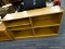 OAK FINISH BOOKSHELF UNIT; HAS 3 ADJUSTABLE SHELVES AND 2 SIDES. MEASURES 49 IN X 12 IN X 29 IN
