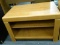 ENTERTAINMENT STAND; CHERRY FINISH WITH 1 LOWER SHELF. MEASURES 32 IN X 21 IN X 20 IN