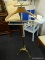 BRASS STANDING SUIT VALET WITH WOODEN HANGER; HAS TRAY ON TOP AT FINISL OVER WOODEN HANGER PORTION,