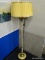 ELEGANT CANDLESTICK FLOOR LAMP WITH YELLOW PLEATED LAMPSHADE; SCALLOPED PLEATED SHADE SITTING ABOVE