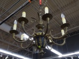BRONZE COLORED CANDLESTICK CHANDELIER; HAS A TOTAL OF 8 LIGHTS. HAS A PINEAPPLE STYLE LOWER FINIAL