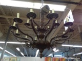 2-TIERED CANDLESTICK CHANDELIER; HAS A TOTAL OF 18 LIGHTS. HAS A LOWER ACORN FINIAL AND IS IN