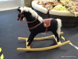 VINTAGE CHILD'S ROCKING HORSE; BLACK ROCKING HORSE WITH WHITE MANE AND TAIL. THIS HORSE HAS A SADDLE