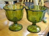 SET OF GREEN GLASS PEDESTAL BOWLS; THIS LOT CONTAINS 2 GREEN GLASS PEDESTAL BOWLS WITH BUNCHES OF