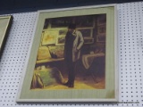 FRAMED PRINT; THIS FRAMED PRINT SHOWS A MAN LOOKING AROUND IN WHAT LOOKS TO BE A GALLERY. IT IS