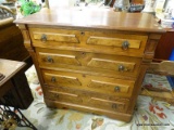 VINTAGE WOODEN CHEST OF DRAWERS; THIS CHEST OF DRAWERS HAS A BEVELED RECTANGULAR TOP, CARVED AND