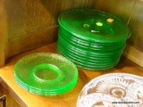 SET OF GREEN GLASS PLATES; THIS 17 PIECE SET INCLUDES 12 GREEN GLASS SALAD PLATES, AND 5 GREEN GLASS