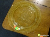 YELLOW DEPRESSION PLATE; HAS AN ETCHED BORDER AND CENTER STARBURST/MEDALLION PATTERN WITH SCALLOPED