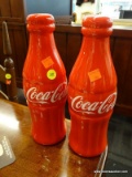 PAIR OF COKE COIN BANKS; PAIR OF COCA-COLA BOTTLE SHAPED COIN BANKS. BOTH ARE IN EXCELLENT