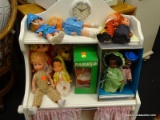 LOT OF BABY DOLLS; INCLUDES 10 TOTAL VINYL DOLLS IN VARIOUS COLORED OUTFITS OF VARYING STYLES.