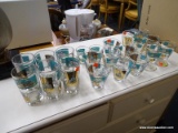 SOUTH CAROLINA THEMED GLASSWARE; INCLUDES 6 ICE TEA GLASSES, 7 LOWBALL GLASSES, 2 SHOT GLASSES, AND