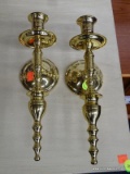 WALL SCONCES; PAIR OF BRASS SINGLE CANDLE SCONCES WITH URN SHAPED LOWER FINIALS. EACH MEASURES 12 IN