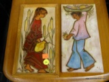 PAIR OF MADE IN SPAIN WALL PLAQUES; 1 DEPICTS A YOUNG GIRL WATERING CROPS AND 1 DEPICTS A YOUNG GIRL