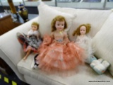 3 VINTAGE DOLL LOT; ALL HAVE MOVING EYELIDS. 1 IS IN A BLACK DRESS, 1 IS IN A PINK DRESS AND 1 IS IN