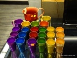 1960'S DRINK SET; INCLUDES A RED PITCHER, A GOLD, A GREEN, A PURPLE, A RED, AND A YELLOW MUG, AND 3