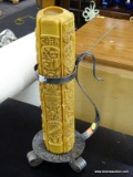 METAL CANDLE HOLDER WITH OVERSIZED CARVED COAT OF ARMS THEMED CANDLE; MEASURES 18 IN TALL