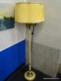 ELEGANT CANDLESTICK FLOOR LAMP WITH YELLOW PLEATED LAMPSHADE; SCALLOPED PLEATED SHADE SITTING ABOVE
