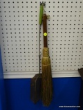 (WALL) 2 PIECE HANGING DECOR LOT; THIS LOT INCLUDES A DECORATIVE WOODEN HANDLED STRAW BROOM, AND A