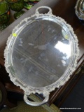 SILVER PLATE OVAL SHAPED TRAY; DOUBLE HANDLED TRAY WITH SCROLLING FLORAL EDGES. UNDERSIDE IS STAMPED