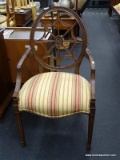 ROUND BACK UPHOLSTERED SEAT ARMCHAIR; VINTAGE WOODEN ARMCHAIR WITH ROUND CARVED BACK THAT HAS SPIDER