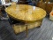 (R2) OVAL WOODEN DINING TABLE WITH INLAY PATTERNED TOP SURFACE; HAS OCTAGONAL LEGS AND IS IN VERY