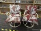 (R3) PAIR OF ROCKING PATIO CHAIRS; MADE OF ALUMINUM WITH VINYL SEATS AND BACKS. HAVE FLORAL CUSHIONS