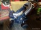 (R3) GRACO STROLLER; NAVY AND WHITE GRACO STROLLER MODEL# 7496BK-JJ. THIS STROLLER HAS CUP HOLDERS,