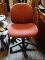 (R3) ROLLING OFFICE CHAIR; IS MAROON IN COLOR WITH BLACK BASE. MEASURES 21 IN X 25 IN X 35 IN